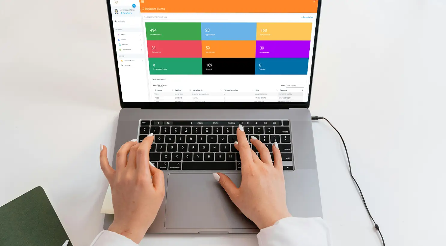Person using management software on a laptop with colorful graphics